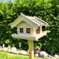 Preview: vogelhaus-heidi-mit-grauen-bitumenschindeln -dunkelbraun-gebeizten -tuer-und-fensterzargen-boden-mit-zaun Preview: vogelhaus-heidi-mit-grauen-bitumenschindeln -dunkelbraun-gebeizten -tuer-und-fensterzargen-boden-mit-zaun